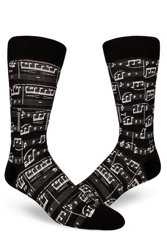 Black crew socks for men with allover sheet music design in white.