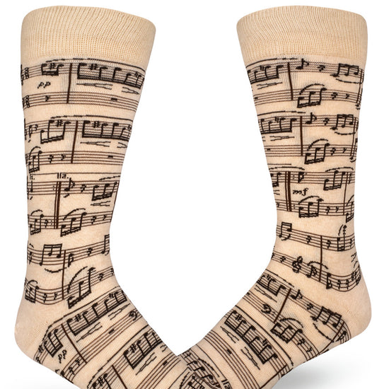 Cream crew socks for men with sheet music design.
