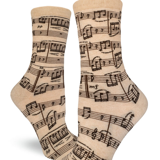 Cream crew socks for women with black sheet music design.