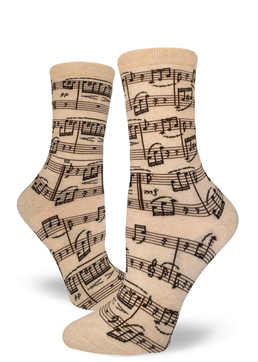 Cream crew socks for women with black sheet music design.