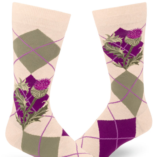 Cream crew socks for men with green and purple argyle pattern and purple thistle flowers.