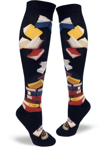 Black knee socks with stacked multicolored books, flying books at the top and an open book with glasses and cup below.