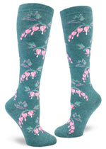 Teal knee socks with allover repeating pattern of pink bleeding heart flowers.