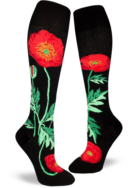 Black knee socks with floral design of large red poppy flowers on green stems and leaves.