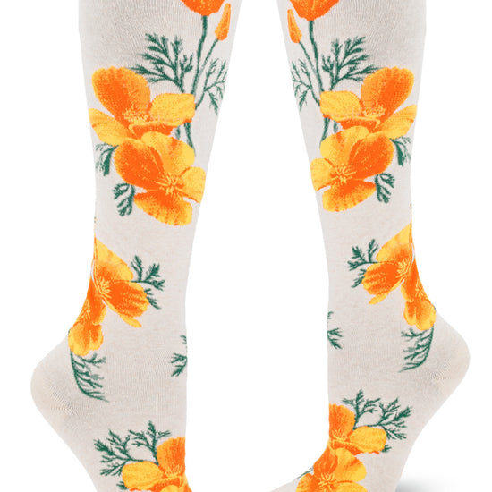 Cream knee socks with bright orange California poppy design of large flowers and green foliage.