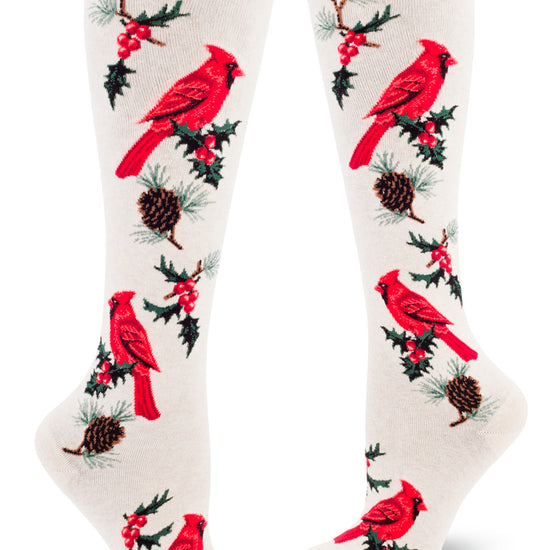 Cream knee socks with red cardinal birds, pinecones and holly leaves and berries.