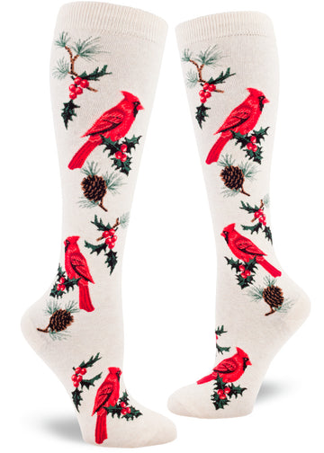 Cream knee socks with red cardinal birds, pinecones and holly leaves and berries.