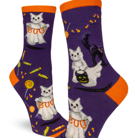 Purple crew socks for women with Halloween cats in ghost costumes, black scaredy cats and candy.
