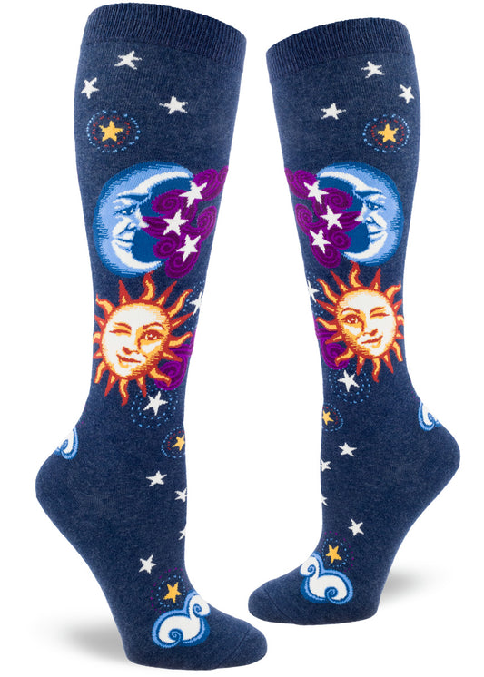 Navy knee socks with suns and moons with faces, with sun winking, purple clouds and stars.