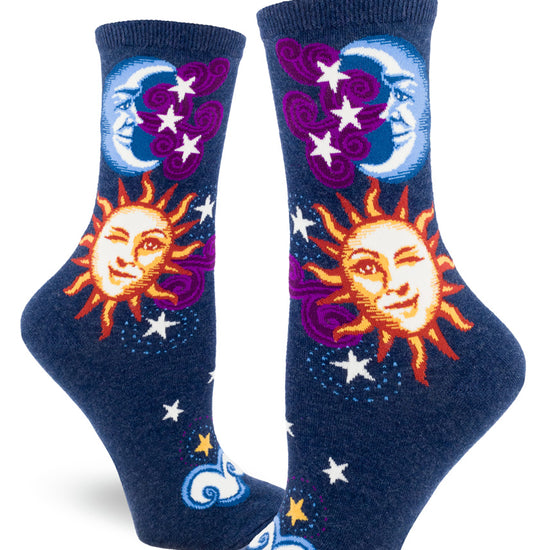 Navy blue crew socks for women with sun, moon and stars design, with faces on sun and moon.