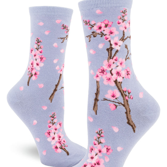 Light purple women's crew socks with pink cherry blossoms and falling petals.
