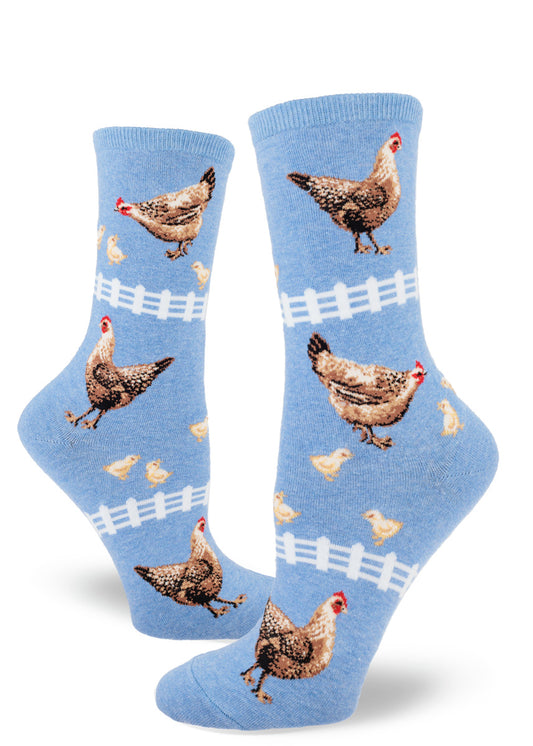 Blue crew socks for women with chicken pattern of hens, chicks and white picket fences.