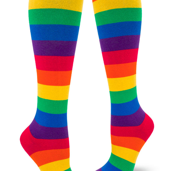 Knee-high rainbow socks with bright colored stripes.