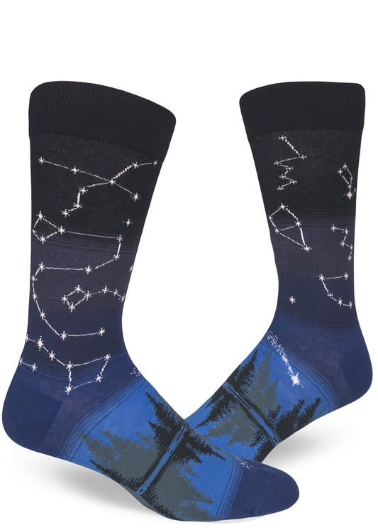 Blue crew socks for men with star constellation design in night sky above a forest and lake.
