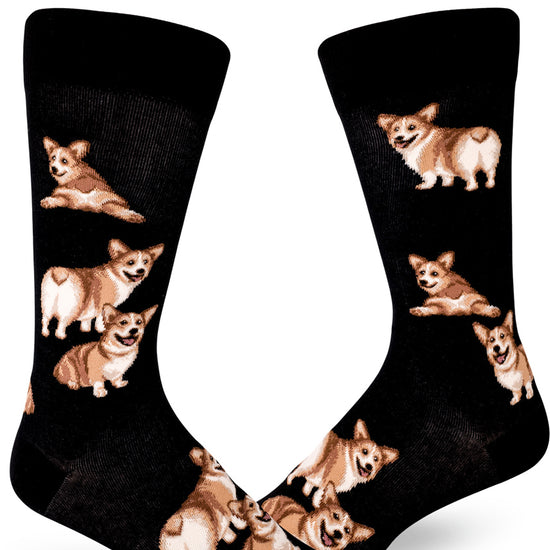 Black crew socks with men with corgi pattern of dogs sitting and showing their butts.