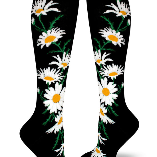 Black knee socks with large white and yellow daisy flowers.