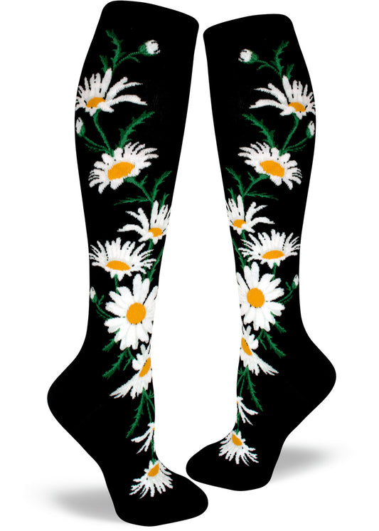 Black knee socks with large white and yellow daisy flowers.