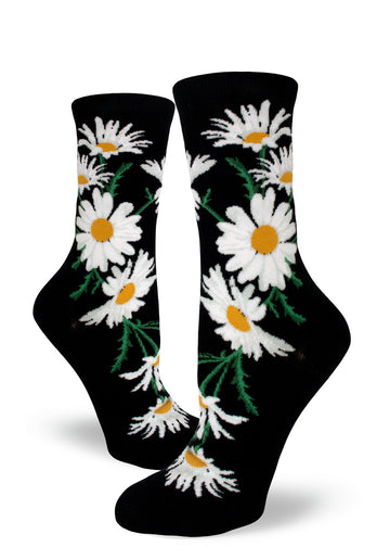 Black crew socks for women with large white and yellow daisy flowers.