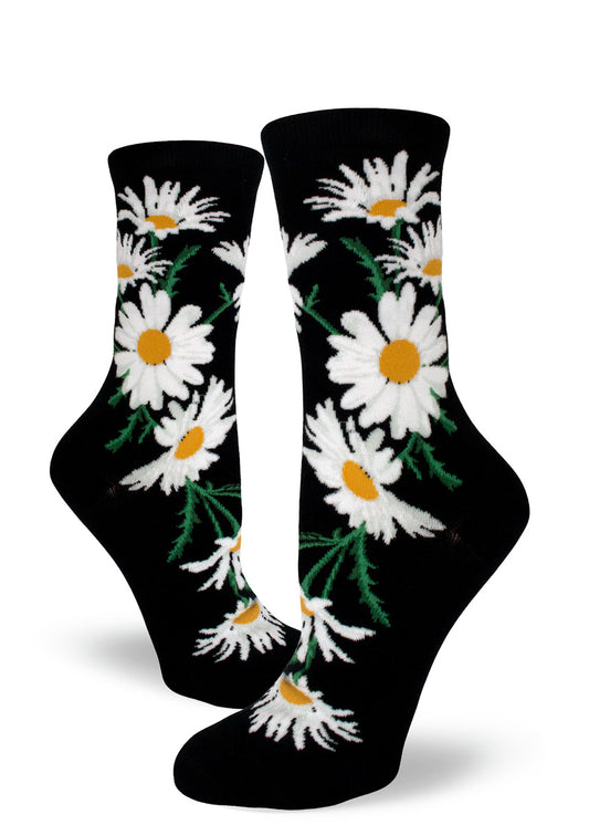 Black crew socks for women with large white and yellow daisy flowers.