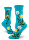 Blue crew socks for women with dandelion flowers and seed heads along with seeds flying.