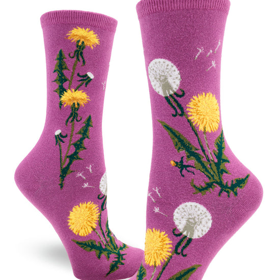 Purple crew socks for women with dandelion flowers, leaves and seed heads with flying dandelion scenes above.