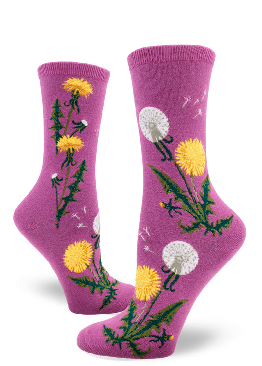 Purple crew socks for women with dandelion flowers, leaves and seed heads with flying dandelion scenes above.