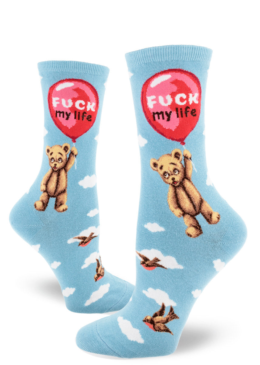 Light blue crew socks for women with teddy bears floating beneath red balloons with the words "Fuck My Life," birds and clouds.
