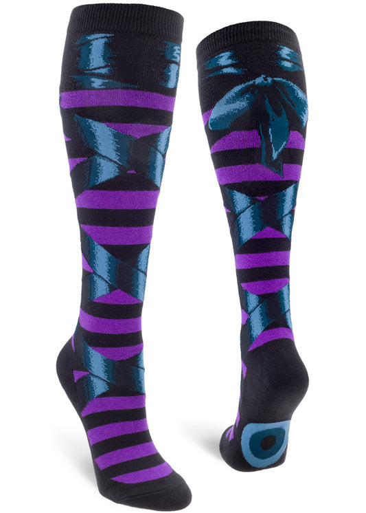 Witchy knee socks with a black and purple stripe pattern topped with black faux lace-up ribbon wrap.