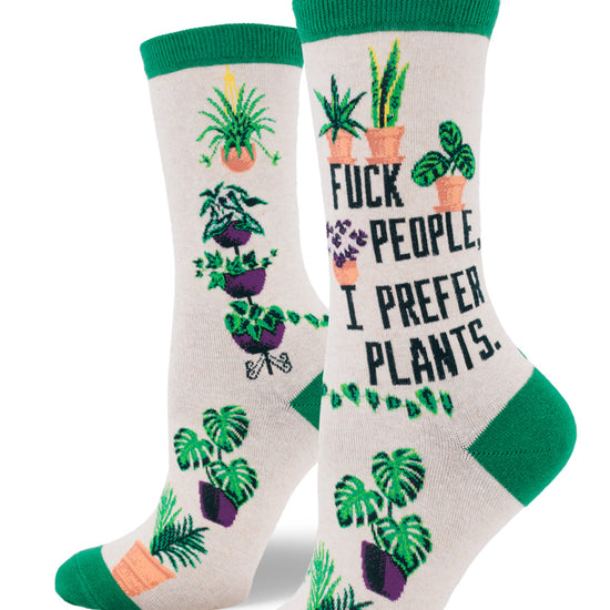 Cream colored crew socks for women with the words "Fuck People, I Prefer Plants,"  and houseplants.