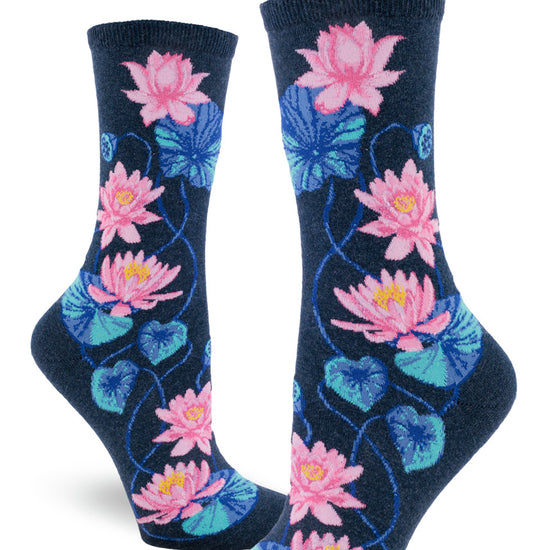 Navy crew socks for women with floral pattern of pink lotuses and blue leaves and seed pods.