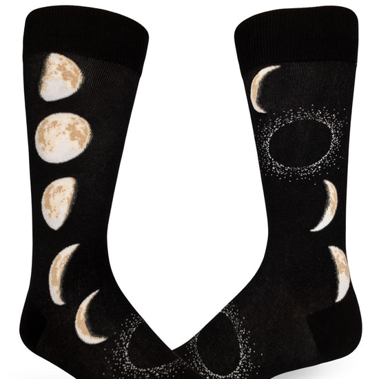 Black crew socks for men with realistic moons in different phases that progress up and down the sides.