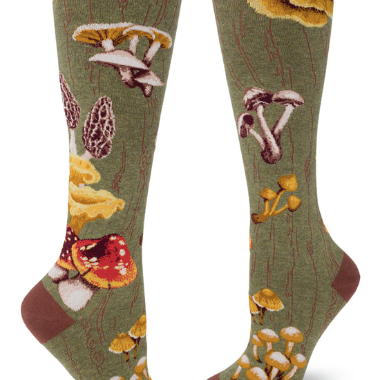 Green knee socks with mossy log pattern and many varieties of wild mushrooms.