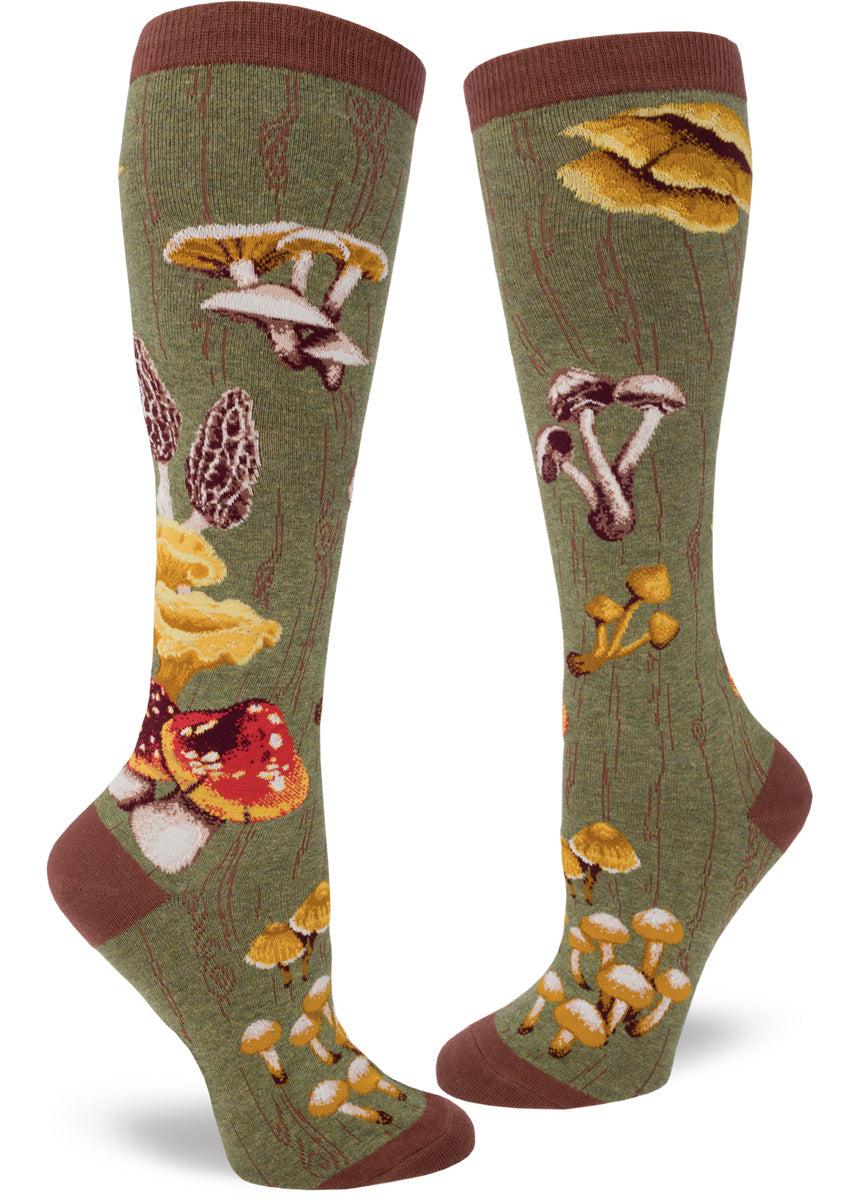 Green knee socks with mossy log pattern and many varieties of wild mushrooms.