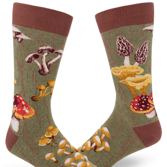 Green crew socks for men with mossy tree bark pattern and wild mushrooms.
