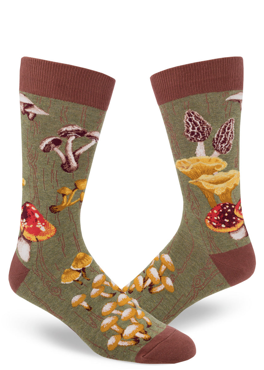 Green crew socks for men with mossy tree bark pattern and wild mushrooms.