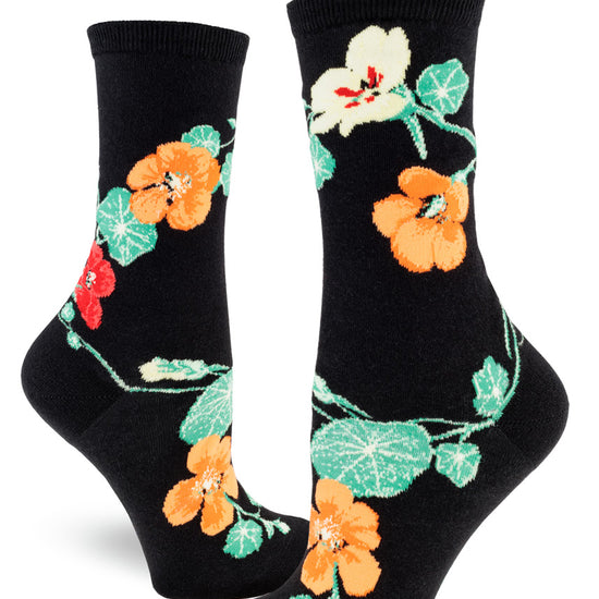 Black crew socks for women with nasturtium flowers in red, orange and yellow, and green foliage.