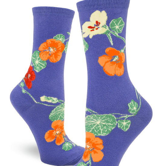 Periwinkle purple crew socks for women with nasturtium flowers in red, orange and yellow along with winding green leaves and stems.