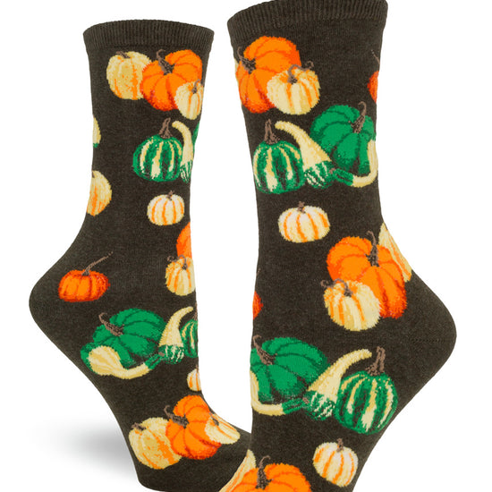 Green women's crew socks with orange pumpkins and colorful gourd varieties.