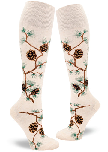Cream knee-high socks with pinecone, branch and pine needle pattern.
