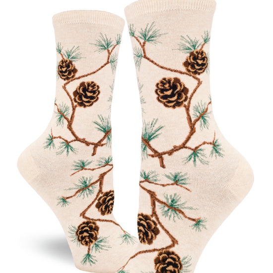 Cream crew socks for women with allover pinecone pattern and branches with clusters of pine needles.