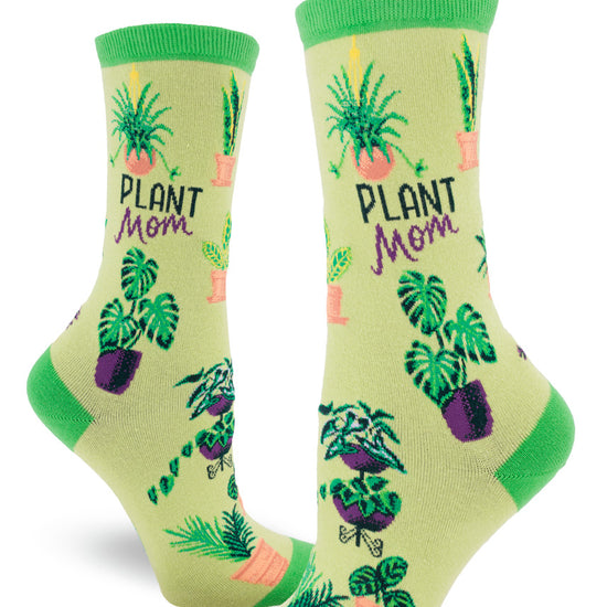 Green crew socks for women with the words "Plant Mom" and assorted potted plants.