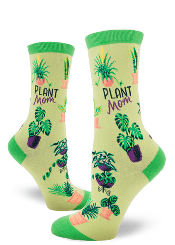 Green crew socks for women with the words "Plant Mom" and assorted potted plants.