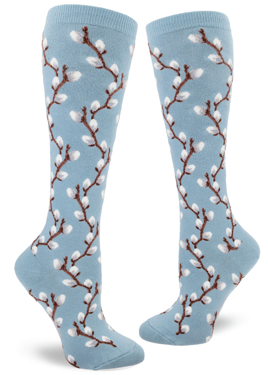 Knee socks with blue background and pussy willow design in raised textures yarn.