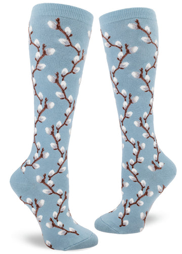 Knee socks with blue background and pussy willow design in raised textures yarn.