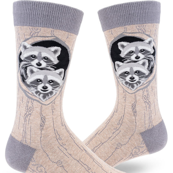 Gray crew socks for men with realistic baby raccoons in their dens and allover tree bark pattern.