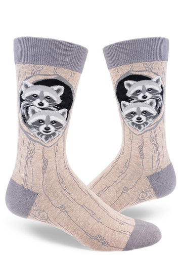 Gray crew socks for men with realistic baby raccoons in their dens and allover tree bark pattern.