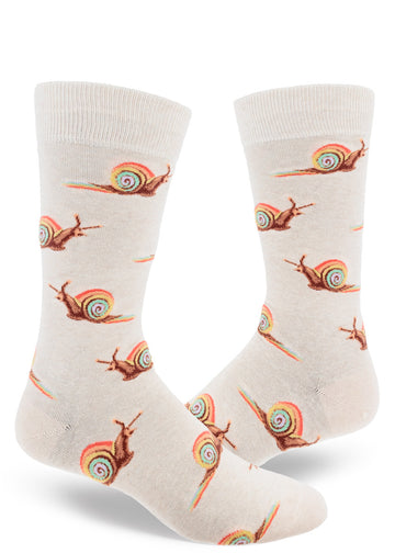 Cream colored crew socks for men with rainbow snails leaving trails of rainbow slime in repeating allover pattern.