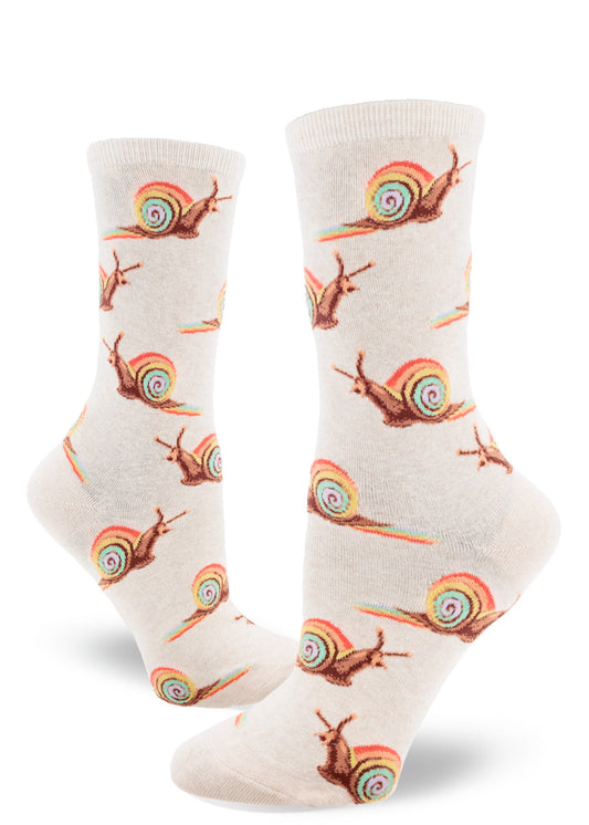 Cream crew socks for women with snails in rainbow shells leaving rainbow trails behind them in allover repeating pattern.