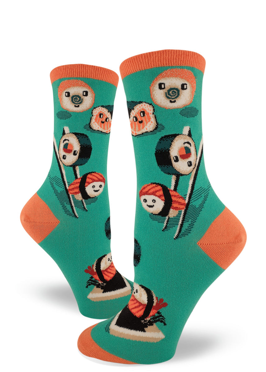 Fun teal women's crew socks with allover cute cartoon sushi smiling, playing with chopsticks and swimming in soy sauce dishes.