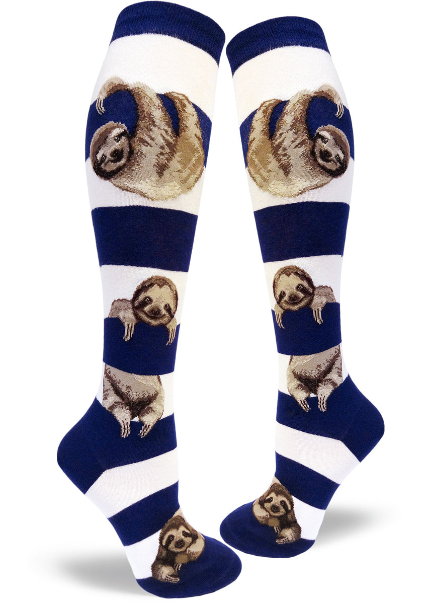 Navy and white striped knee-high socks featuring cute realistic sloths hanging between stripes.